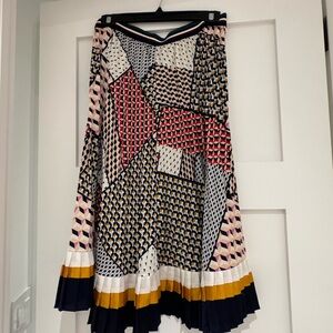 Colourful pleated skirt.